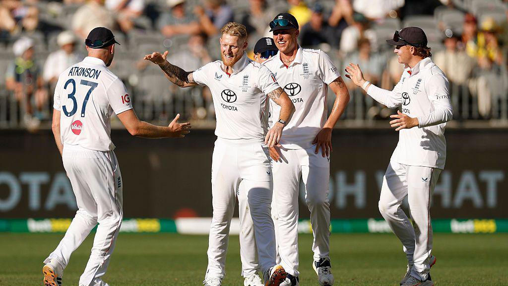 Ben Stokes celebrates taking a wicket with Gus Atkinson, Ollie Pope and Brydon Carse