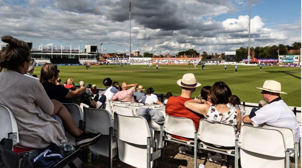 People watching a cricket match