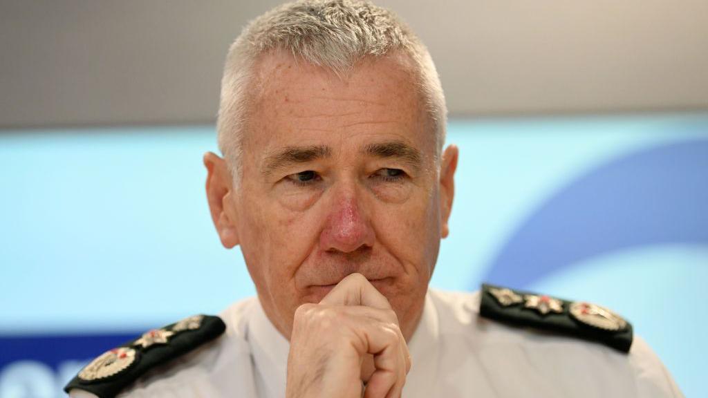 Jon Boutcher at a press conference. He is in his PSNI uniform.