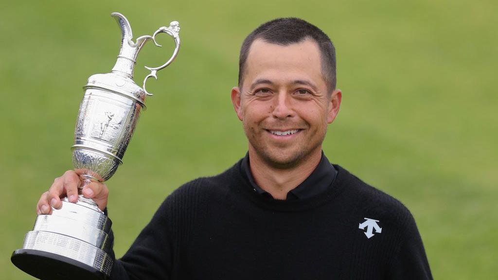 Xander Schauffele holding the Claret Jug after winning The Open in 2024 at Royal Troon