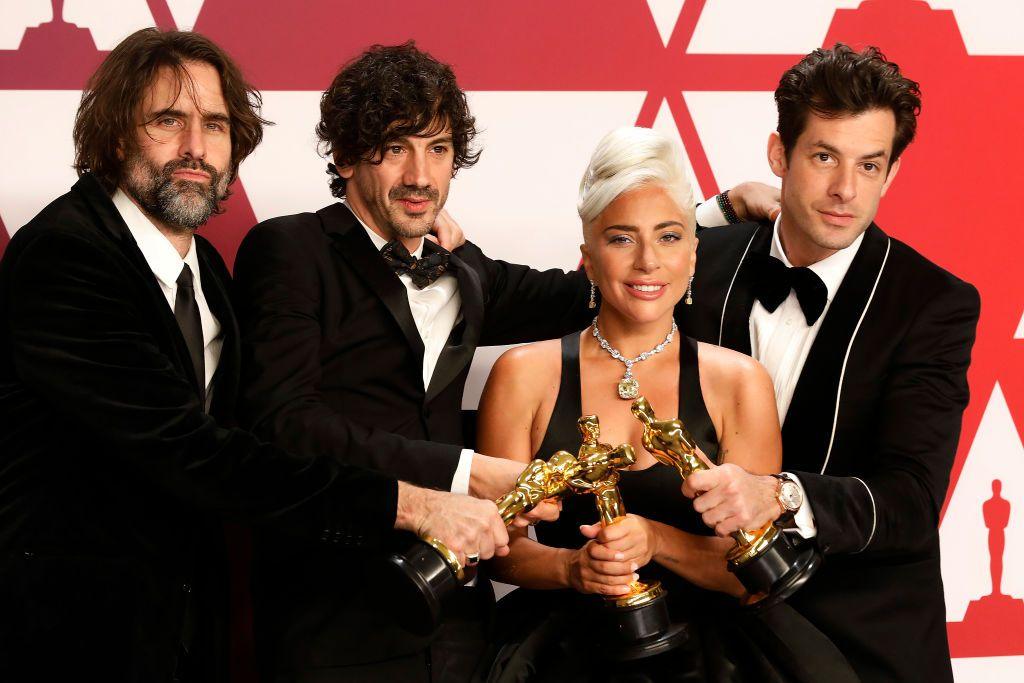 Andrew Wyatt, Anthony Rossomando, Lady Gaga and Mark Ronson pose with their Oscar statuettes