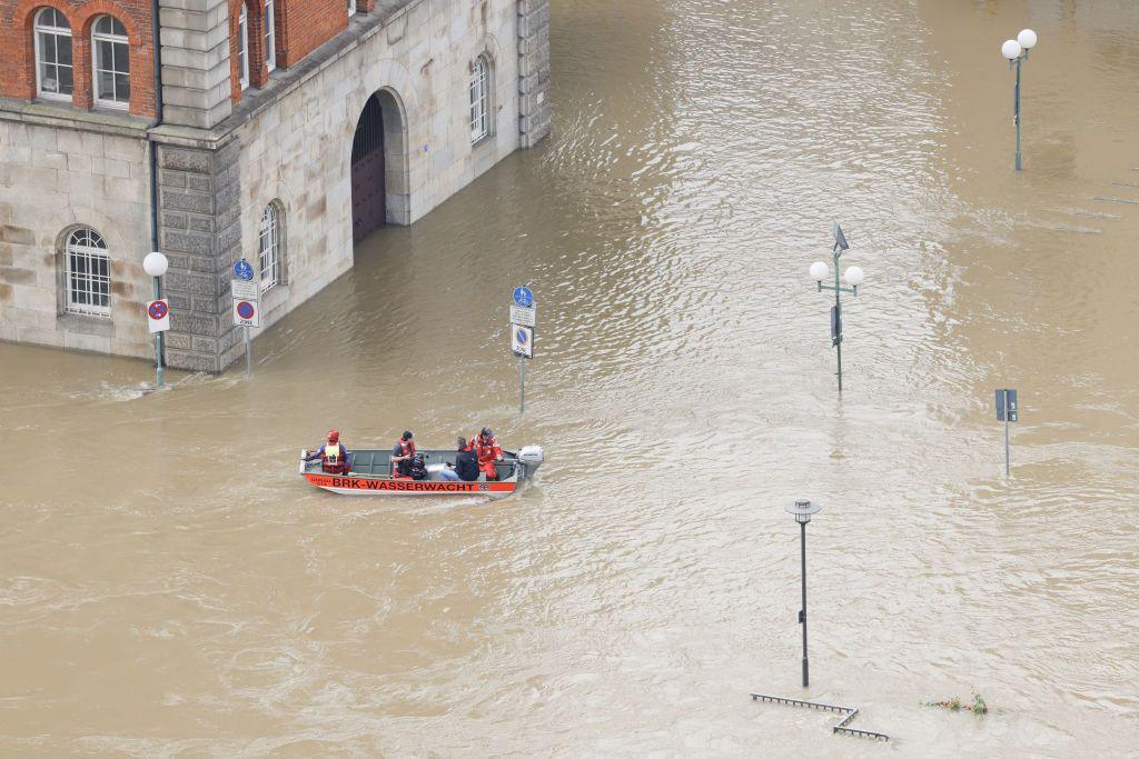 A boat with rescue helpers ships through a flooded street in the center of Passau in Bavaria, southern Germany, on June 4, 2024