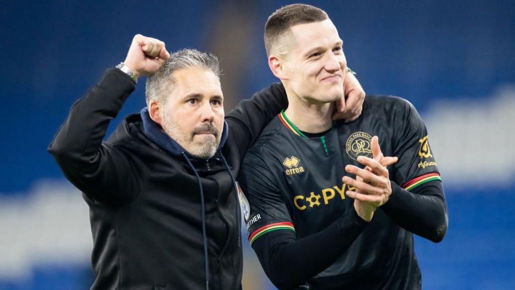 Marti Cifuentes [left] and Zan Celar celebrate with the QPR fans