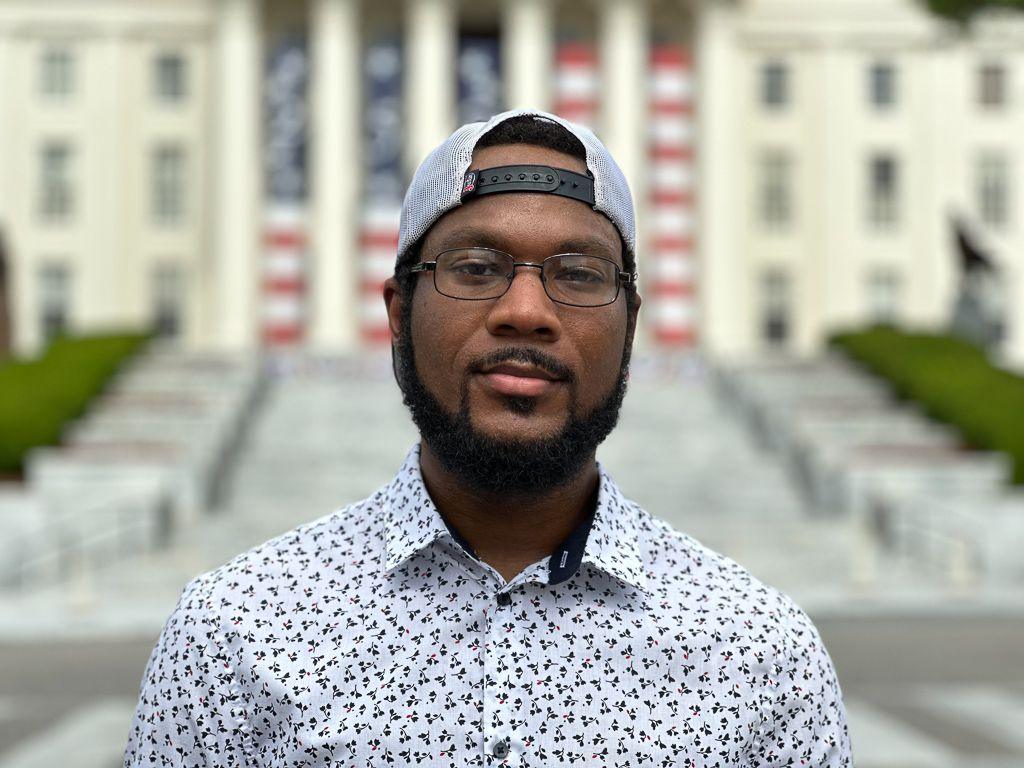 Cedric Coley stands for a portrait outside the Alabama state capitol building 