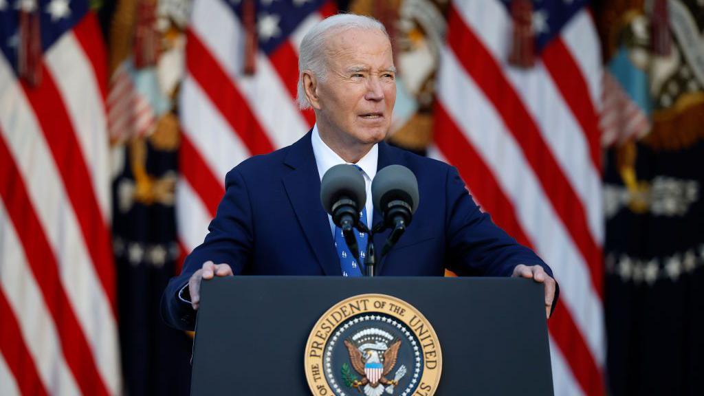 Biden speaking at a lectern