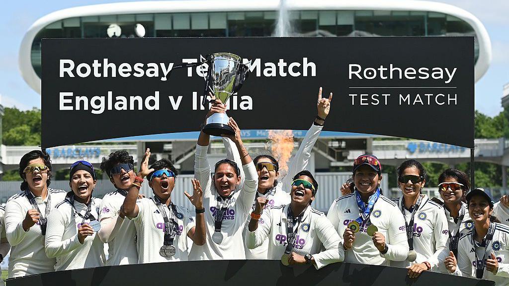  India captain Harmanpreet Kaur holds the trophy up after India won the 1st Women's Rothesay Test match against England at Lord's Cricket Ground on July 13, 2026 in London, England. (Photo by Philip Brown/Getty Images)
