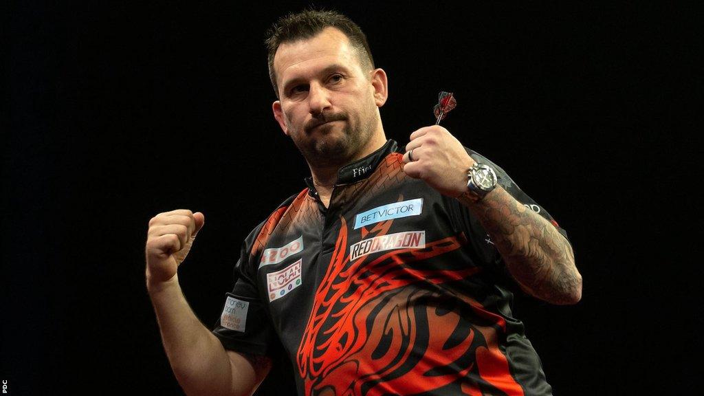 Jonny Clayton celebrates his win over Josh Rock in Leicester