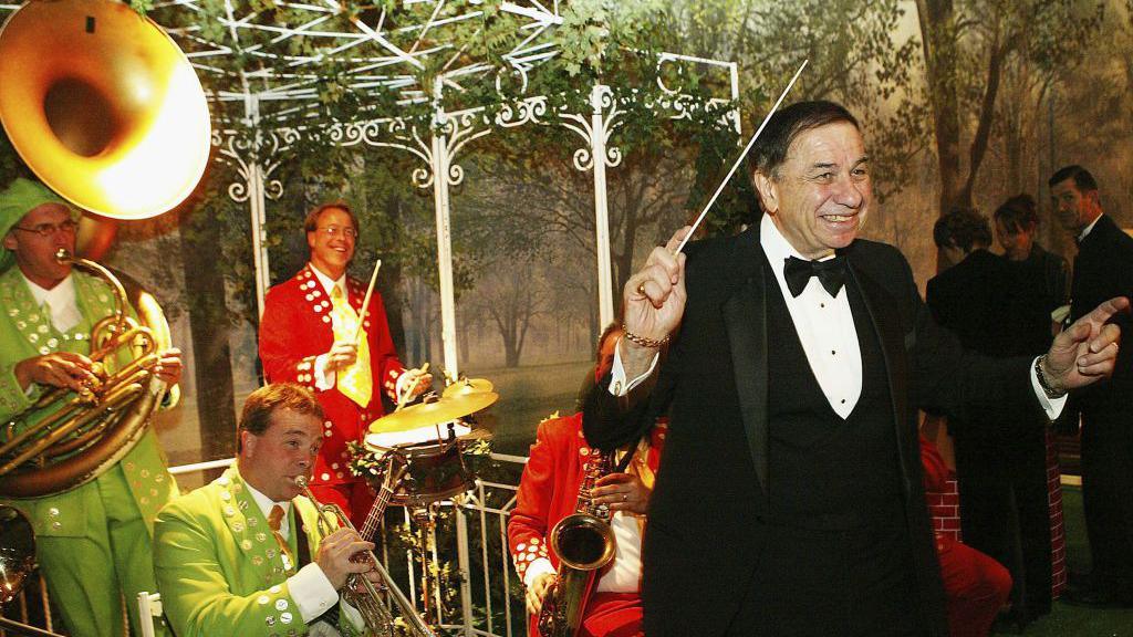 Musical composer Richard Sherman conducts the band at the after-party for Disney's "Mary Poppins" 40th Anniversary Edition DVD Launch party and screening at Hollywood and Highland on November 30, 2004 in Los Angeles, California.