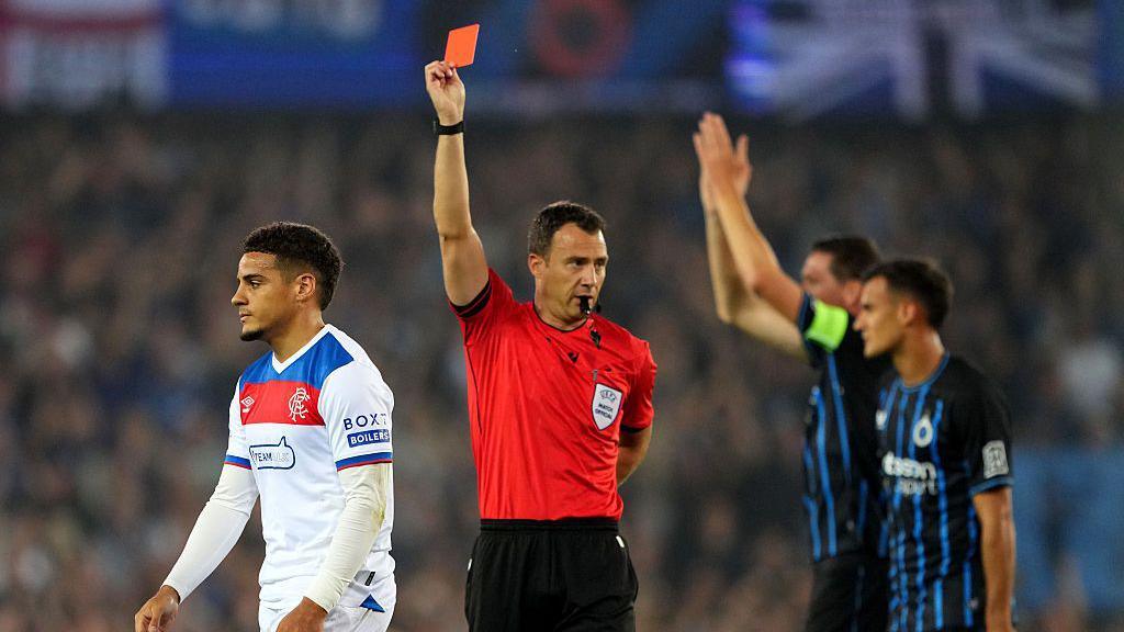 Max Aarons being shown a red card.