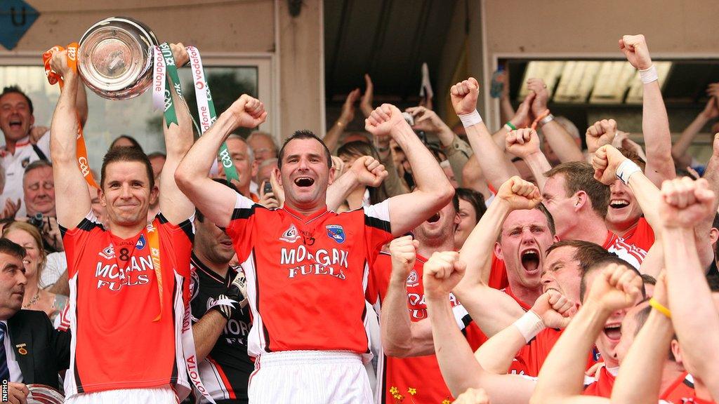 Armagh's 2008-winning team celebrate with the Anglo-Celt Cup after beating Fermanagh in a replay at Clones