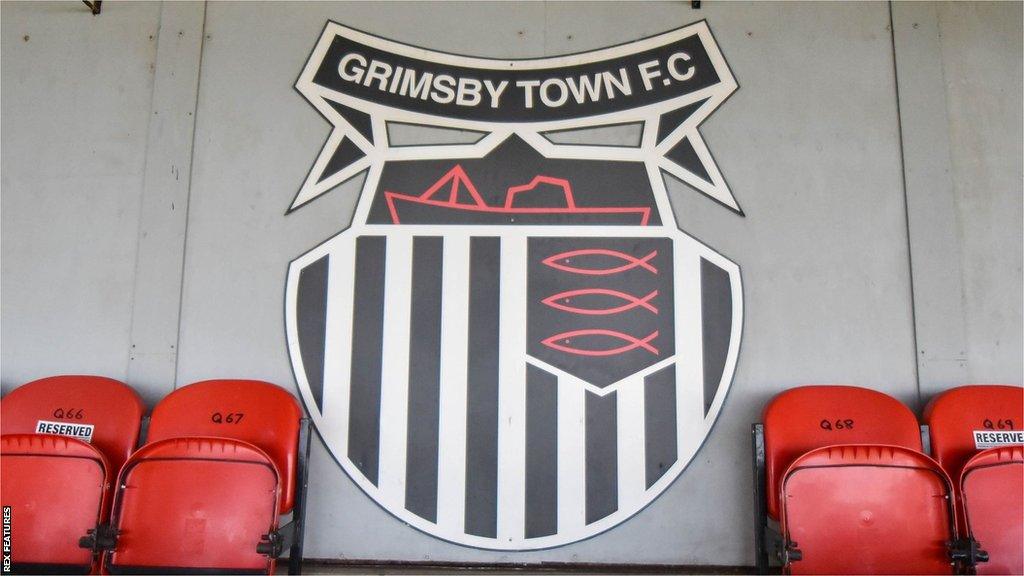 Grimsby Town badge attached to Blundell Park stand