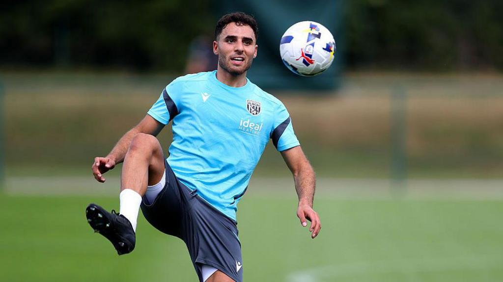 West Bromwich Albion's Tammer Bany stretches his right leg up to control the ball as it flies towards him during a training session