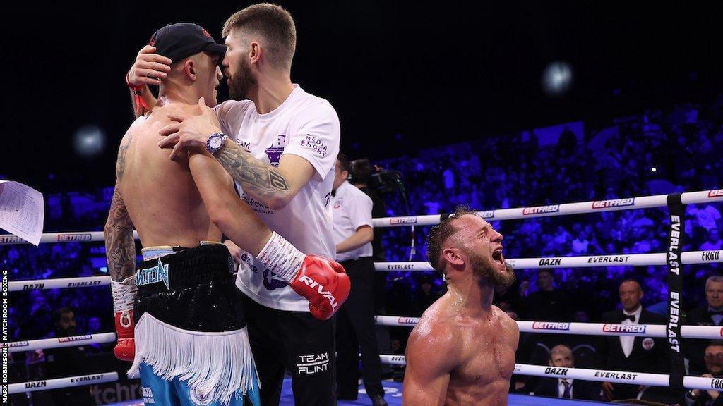 Campbell Hatton is consoled by his coach after suffering first loss