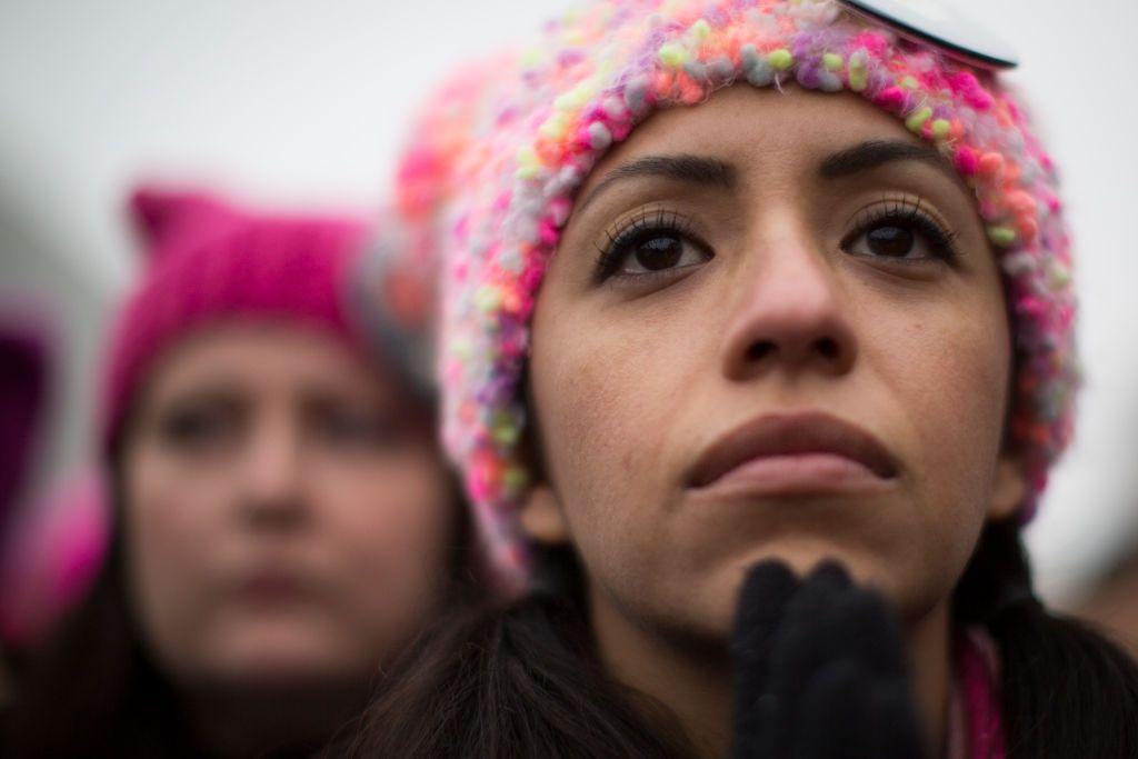 Mayra Black, 34, gets emotional as she listens to the speeches at the Women's March rally a day after the inauguration of President Donald Trump, Saturday, January 21, 2017, in Washington D.C