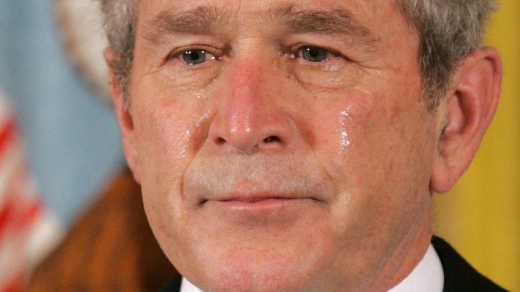  US President George W. Bush cries during a ceremony awarding a posthumous Medal of Honor to US Navy Petty Officer 2nd Class Michael A. Monsoor in 2008