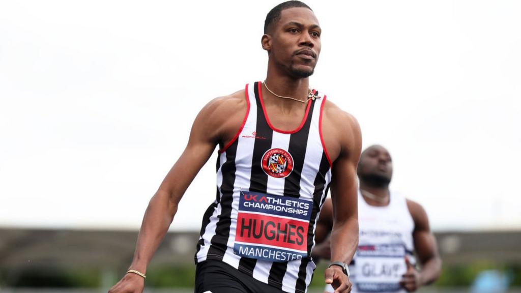 Zharnel Hughes competes in Manchester