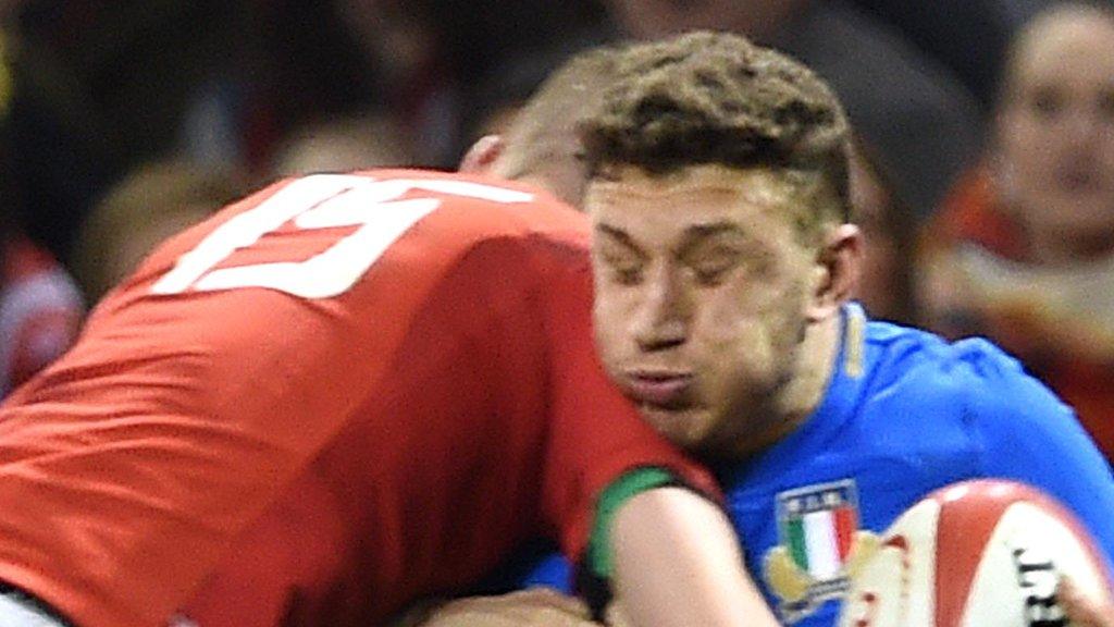 Liam Williams earned a yellow card for this challenge on Matteo Monozzi