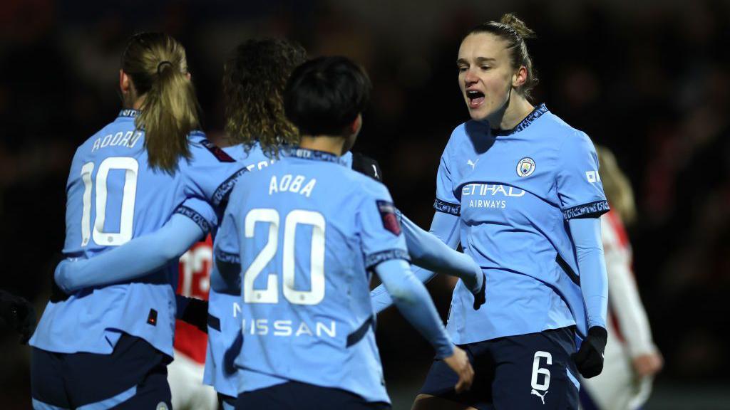 Mary Fowler of Manchester City (obscured) celebrates with teammates Jill Roord, Aoba Fujino and Vivianne Miedema