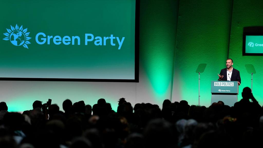 Zack Polanski addresses conference