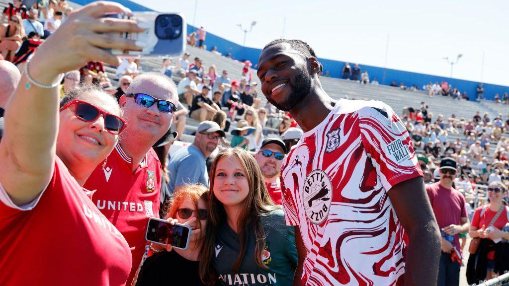 Arthur Okonkwo poses with Wrexham fans