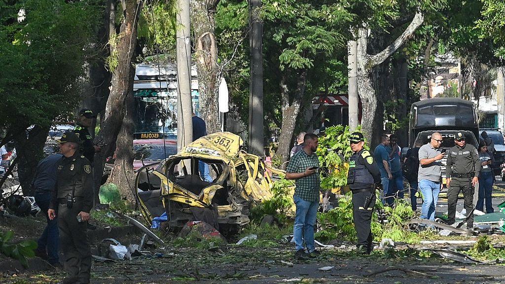 Members of the Colombian police inspect the area of a bomb explosion in Cali, Colombia on 21 August 2025.