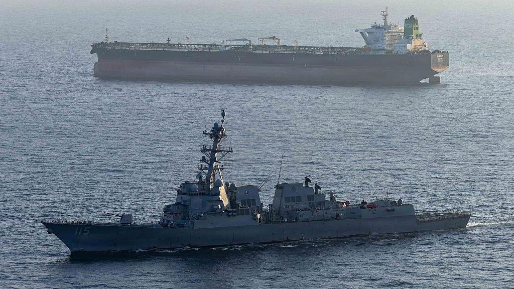 A US military ship is seen in the foreground in the Arabian Sea in April, while another ship is seen in the background.