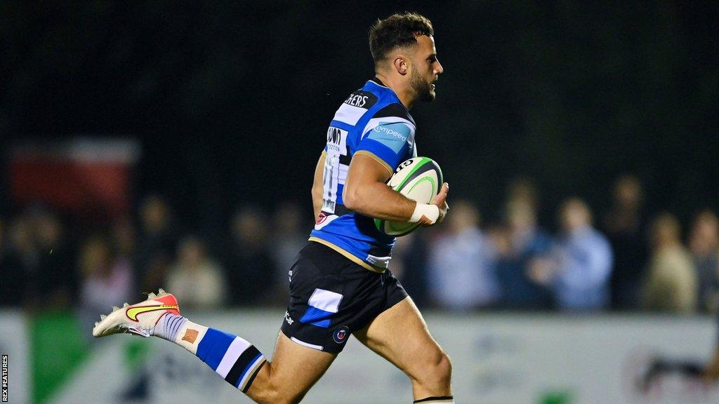 Max Green running over with the ball to score a try for Bath last season