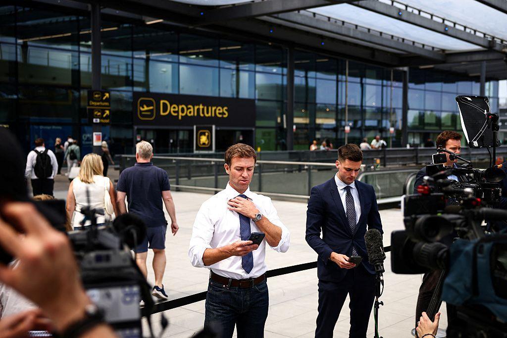 reporters and camera operators outside the departures forecourt of gatwick airport