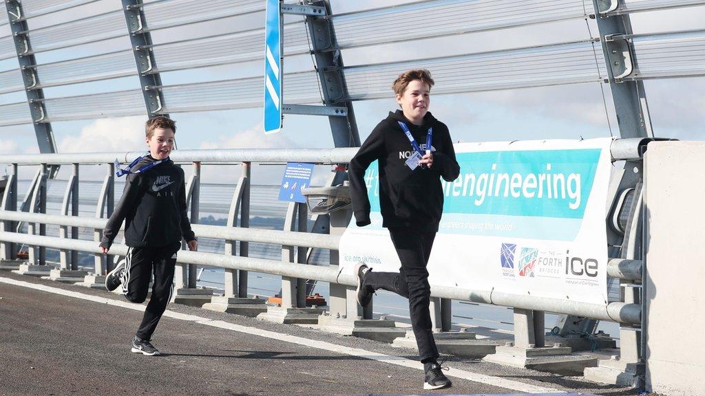 Brothers Martin, 13, (right) and Mark McFarlane from Glasgow sprint across the Queensferry Crossing