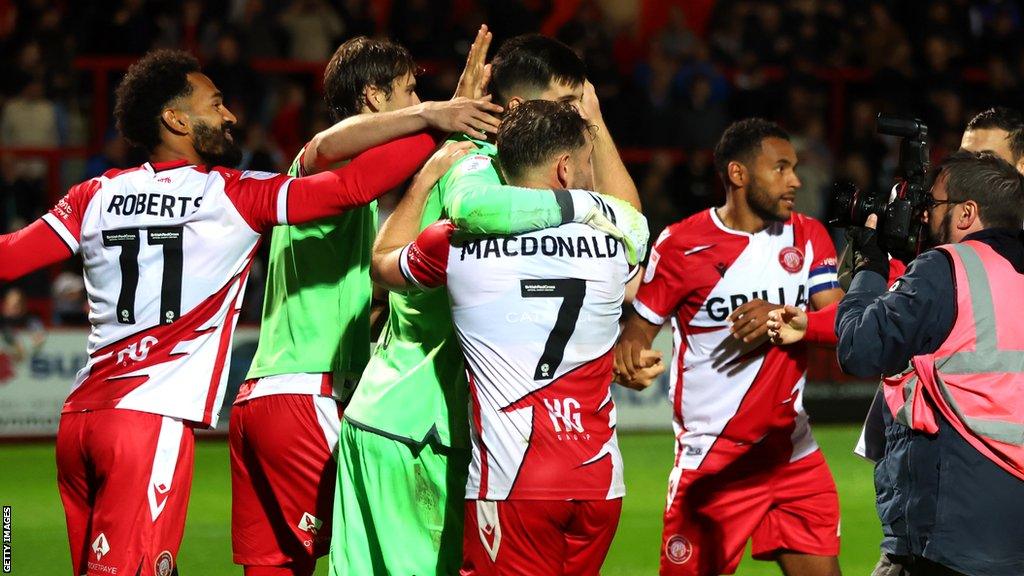 Stevenage players celebrate their win against Watford