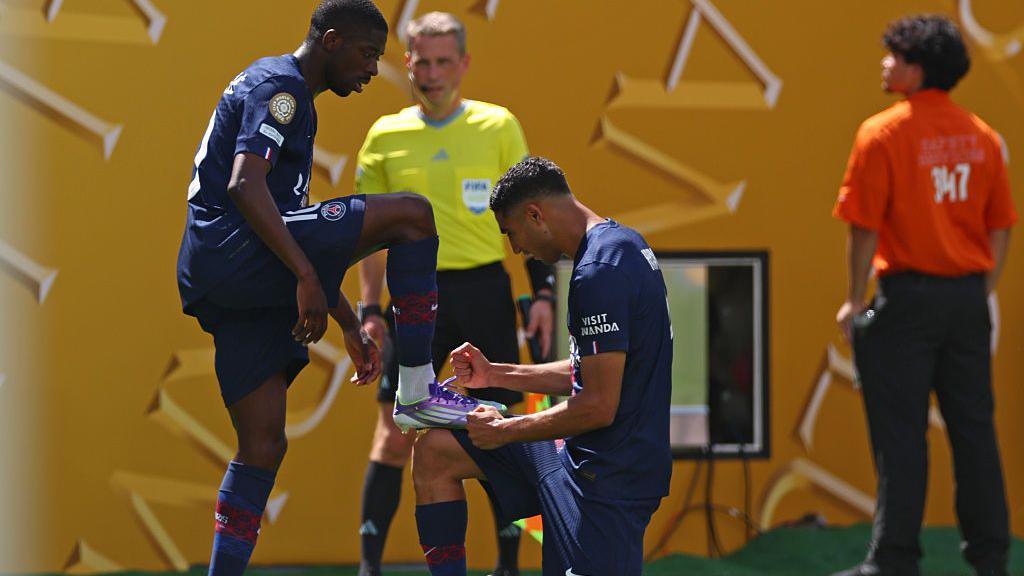 Ousmane Dembele and Achraf Hakimi celebrate
