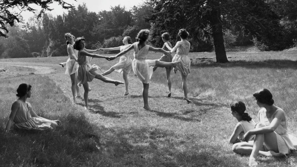 A photo from the 1950s shows students at Tring as they practice their dance routine in the school's picturesque grounds.