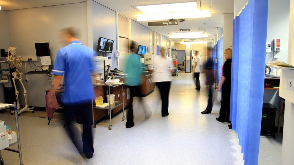 Nurses rush through a hospital