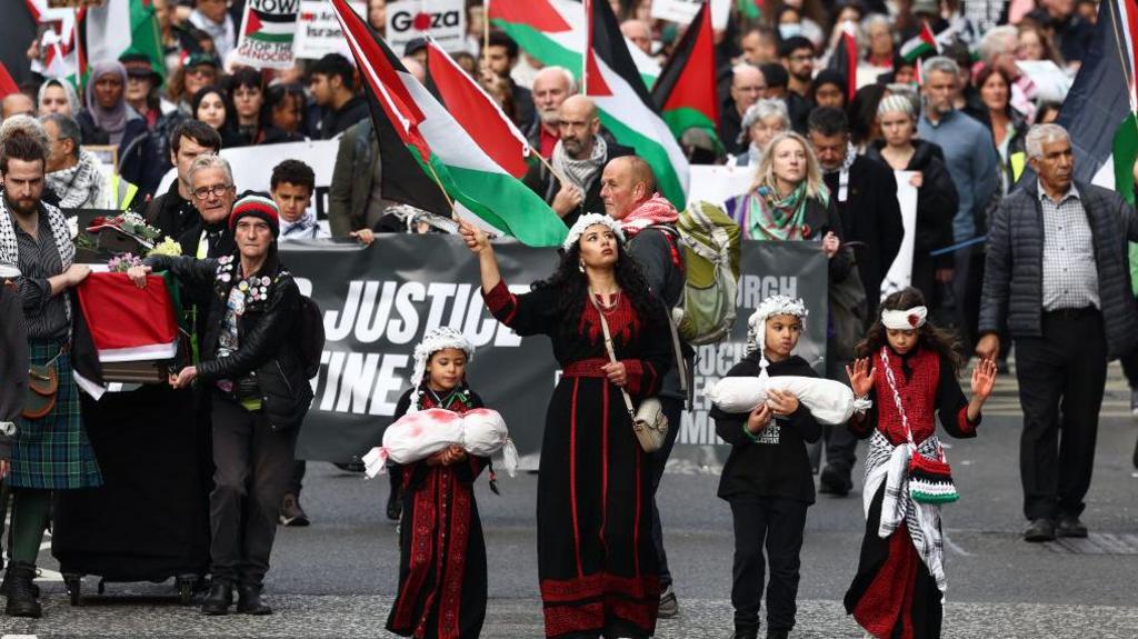  Protesters march during a pro-Palestinians demonstration to mark the first anniversary of the war in Gaza on October 05, 2024 in Edinburgh, Scotland.