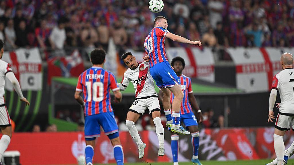 Crystal Palace midfielder Adam Wharton wins a header
