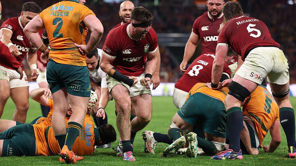 Tom Curry celebrates scoring the Lions' second try against Australia