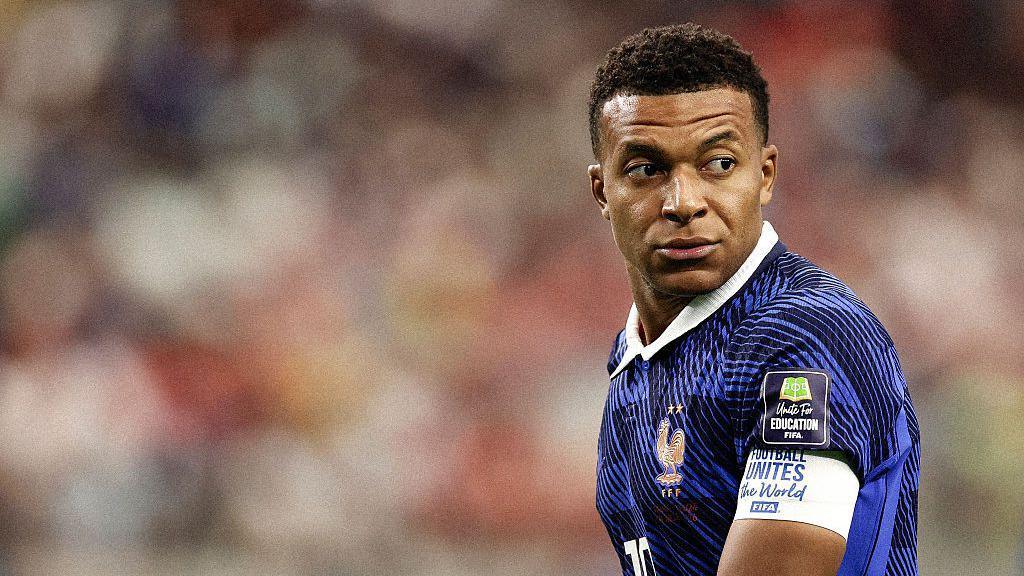 Kylian Mbappe looks on
