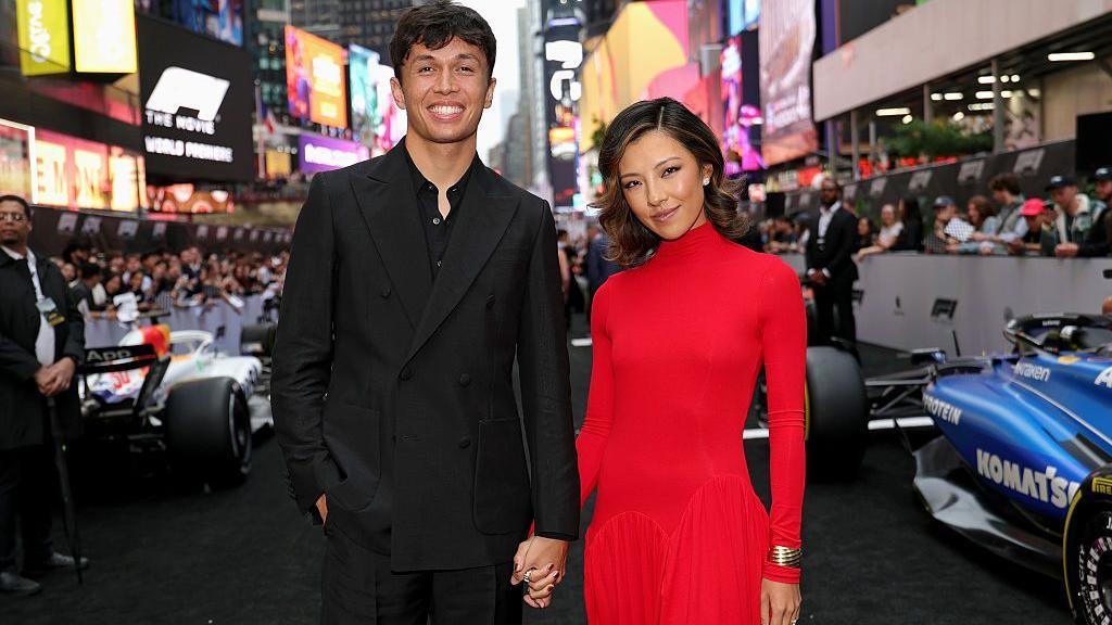 Alex Albon and partner 'Lily' Muni He at Times Square while they attend the world premiere of the F1 movie in June 2025