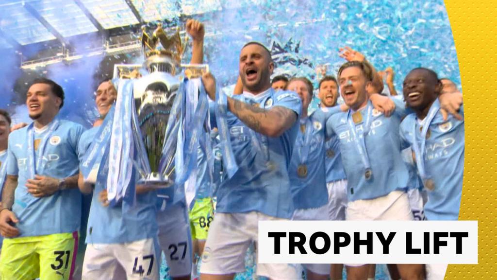 Watch Man City lift Premier League trophy