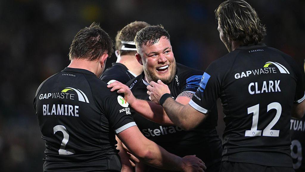 Newcastle Falcons players celebrate a try