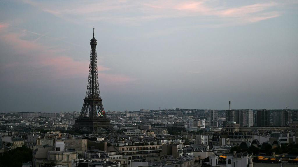 Eiffel Tower in the distance with the Olympic rings visible