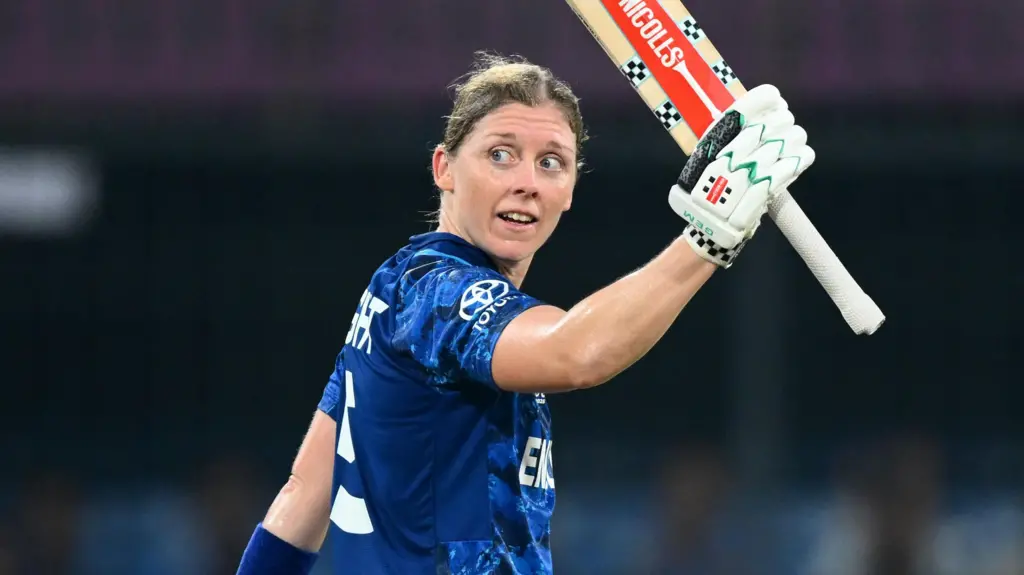Woman cricketer celebrating