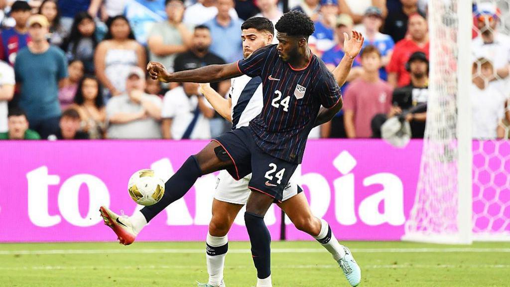 Patrick Agyemang holds the ball up in action for the USA
