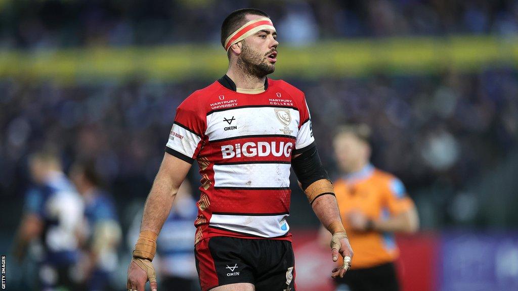 Gloucester captain Lewis Ludlow stands on the pitch