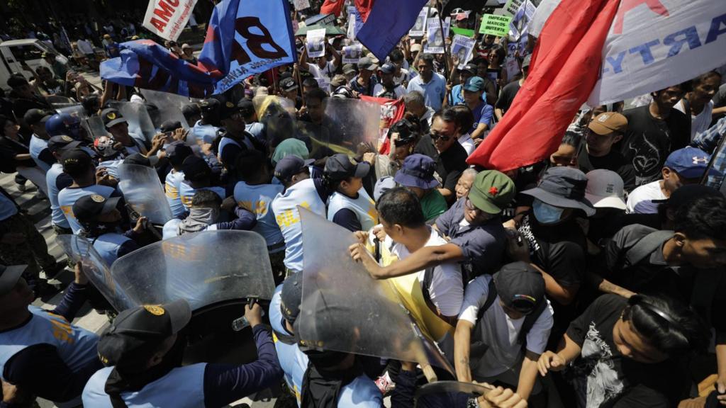 Crowds of protesters clash with police in Manila as Sara Duterte's trial begins