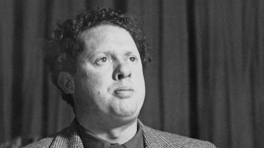 a black and white photograph of Dylan Thomas