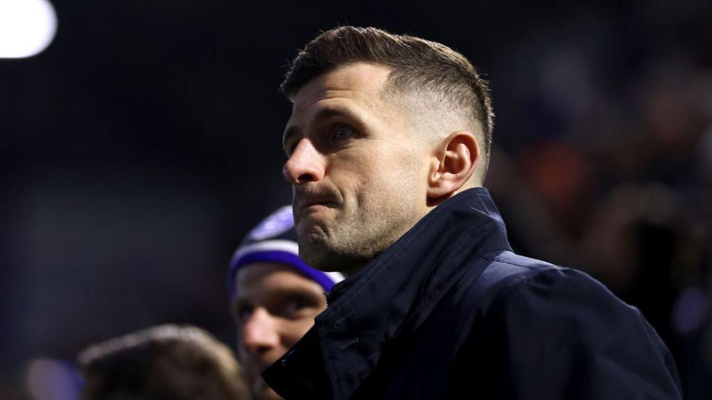 Portsmouth boss John Mousinho looks on