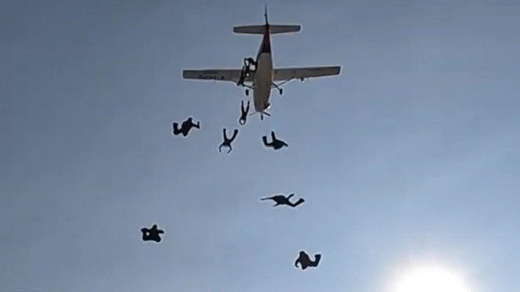 People jumping out of a plane