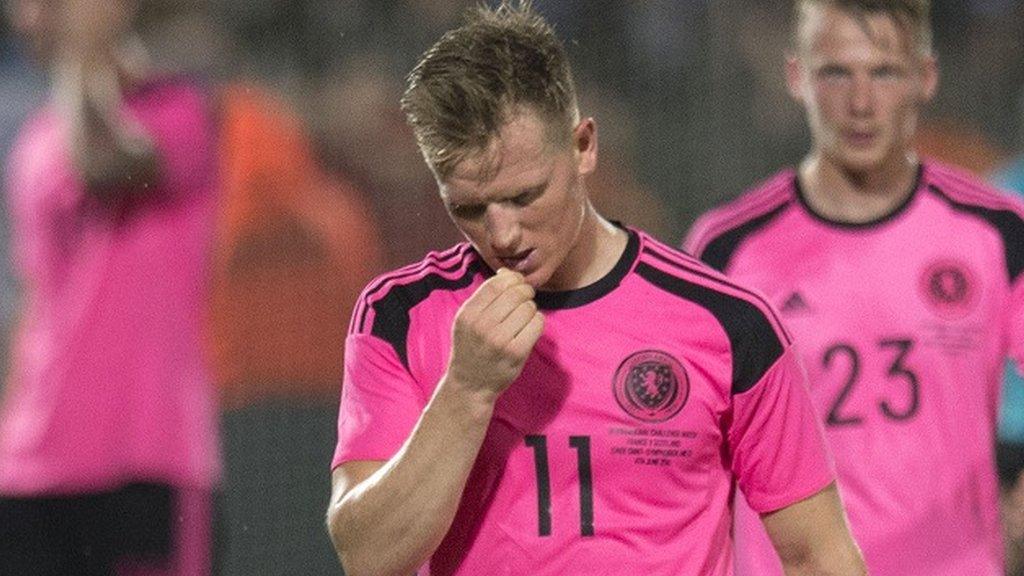 Scotland midfielder Matt Ritchie is left disappointed by defeat in France