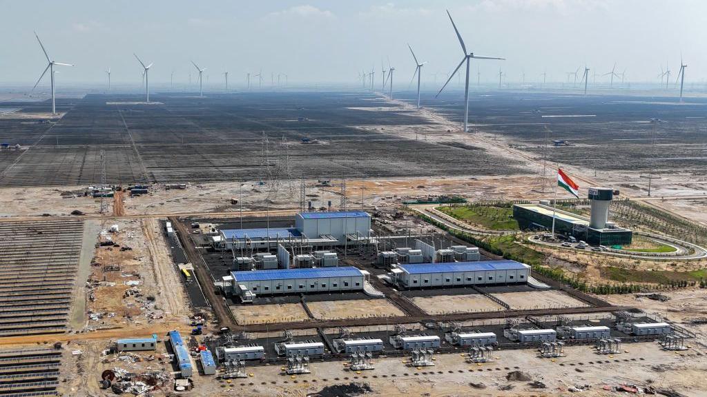 This aerial photograph taken on October 15, 2024 shows solar panels installed at the Adani Green Renewable Energy Plant in Khavda, in India's Gujarat state. 